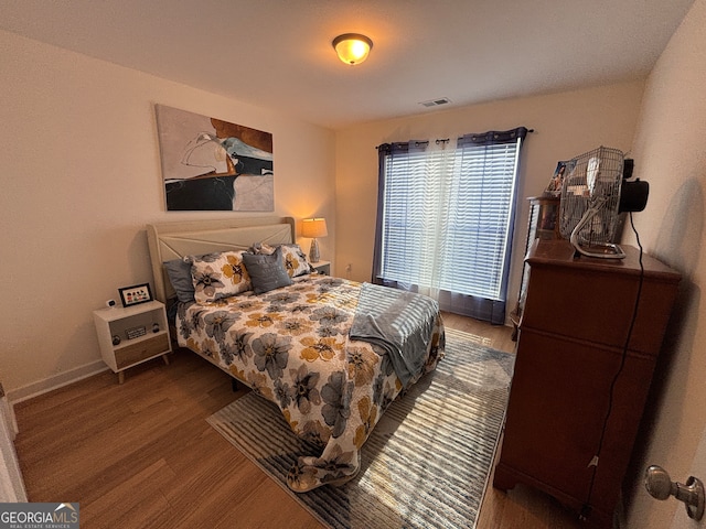 bedroom featuring wood-type flooring