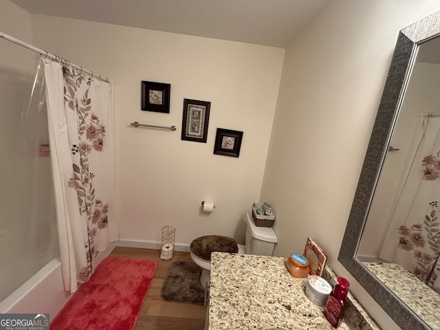 full bathroom with toilet, vanity, shower / tub combo, and hardwood / wood-style flooring