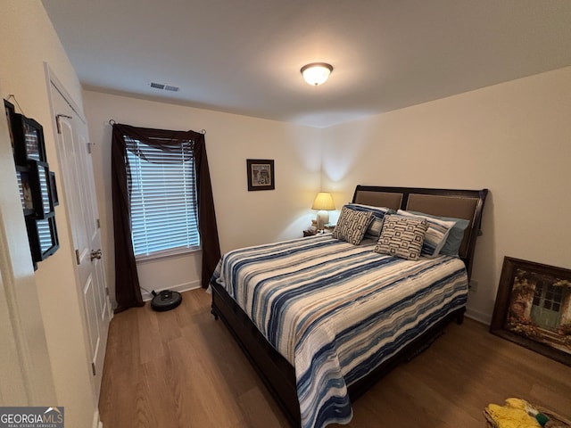 bedroom featuring dark hardwood / wood-style floors