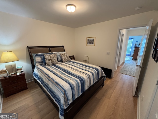 bedroom featuring light wood-type flooring