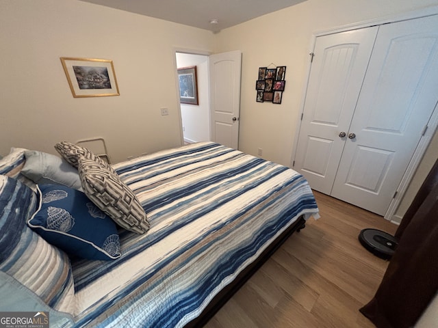 bedroom featuring a closet and hardwood / wood-style floors