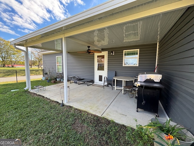 view of patio with grilling area and ceiling fan