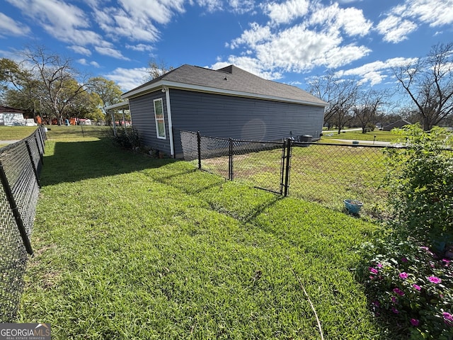 view of home's exterior with a yard