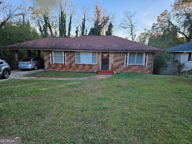 ranch-style home with a front yard and a carport