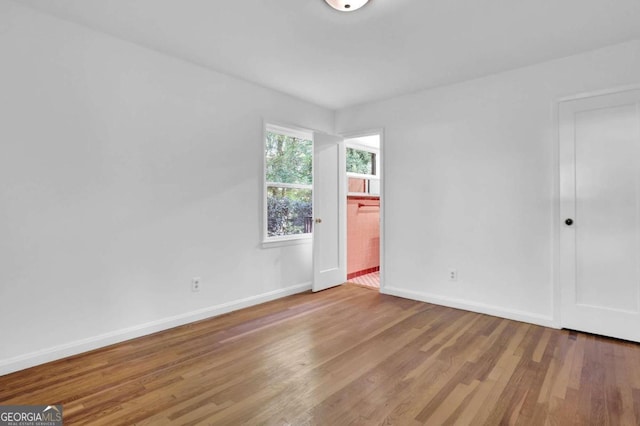 empty room with light hardwood / wood-style floors