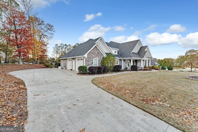 view of front of property with a front lawn and a garage