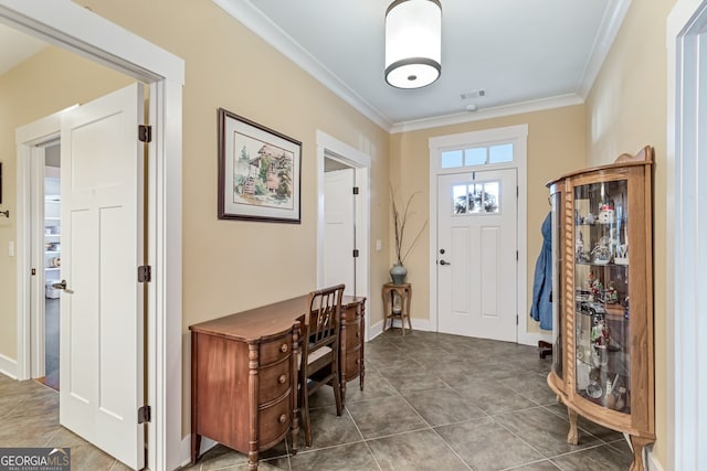 tiled foyer with ornamental molding