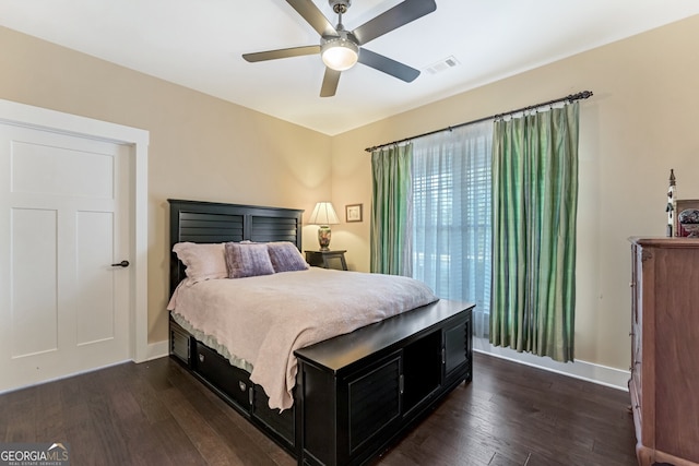 bedroom featuring ceiling fan and dark wood-type flooring