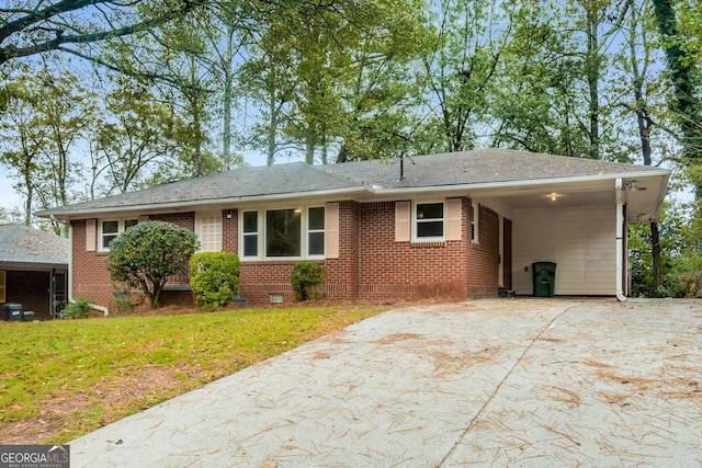 ranch-style home featuring a front yard and a carport