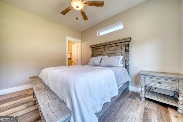 bedroom with hardwood / wood-style floors and ceiling fan