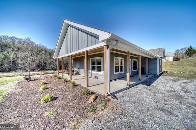 view of side of property featuring a patio