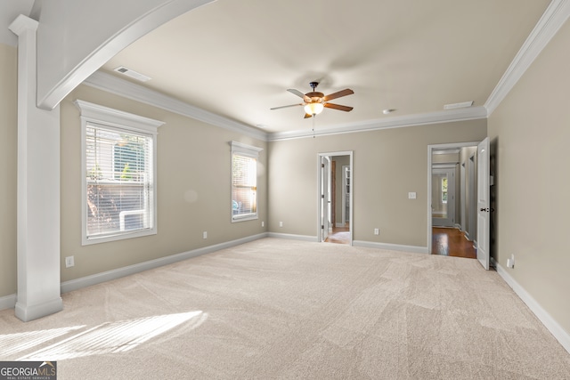 unfurnished room with light colored carpet, ceiling fan, and ornamental molding