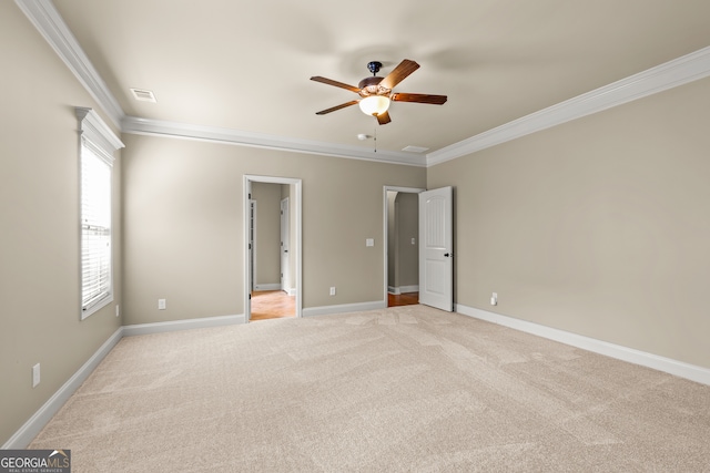 unfurnished bedroom with ceiling fan, ornamental molding, and light carpet