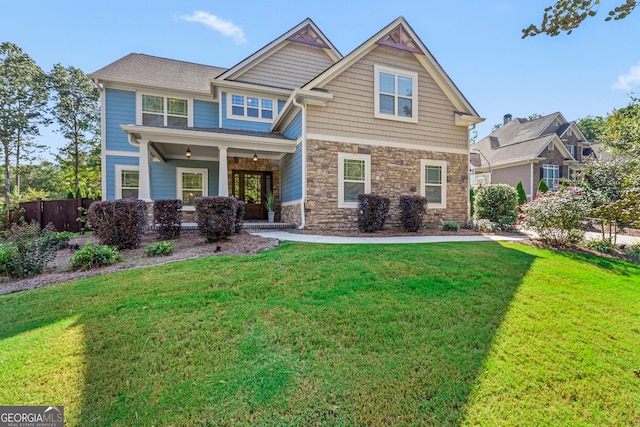 craftsman-style house with a front yard