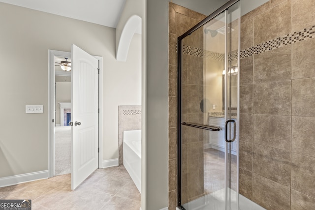 bathroom featuring tile patterned floors, ceiling fan, and independent shower and bath