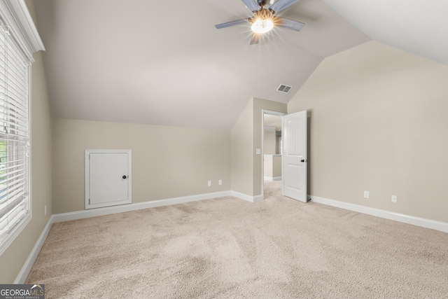 bonus room featuring light colored carpet, ceiling fan, and lofted ceiling