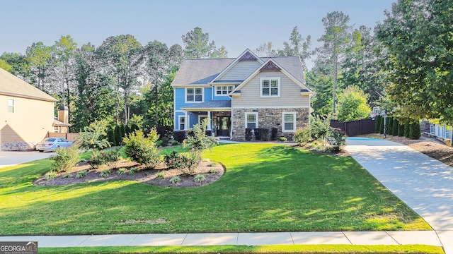 craftsman-style home featuring a front yard