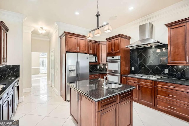 kitchen featuring decorative backsplash, wall chimney exhaust hood, light tile patterned floors, and appliances with stainless steel finishes