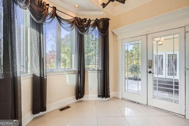 doorway to outside featuring tile patterned floors, crown molding, and french doors