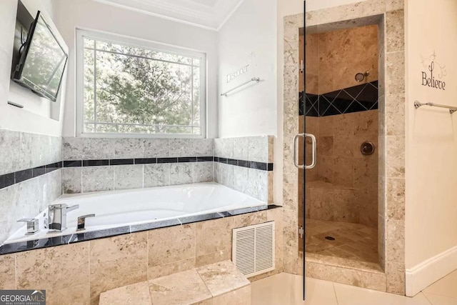 bathroom with tile patterned flooring, a healthy amount of sunlight, crown molding, and plus walk in shower