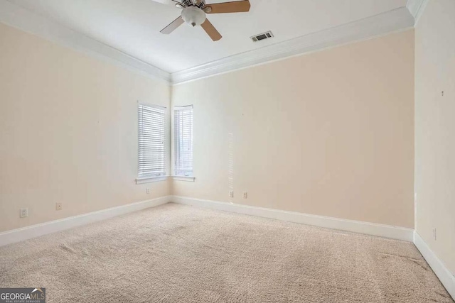 unfurnished room featuring carpet, ceiling fan, and ornamental molding