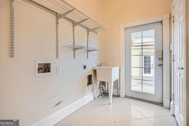 laundry area featuring washer hookup, electric dryer hookup, and light tile patterned flooring