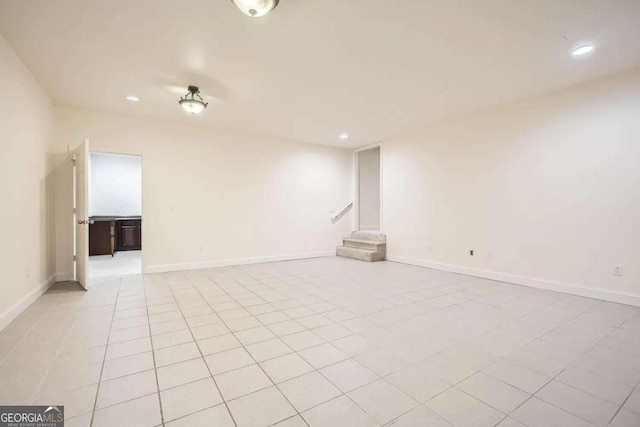 empty room with light tile patterned floors