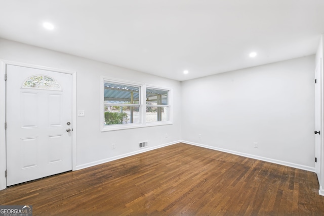 entryway with dark hardwood / wood-style flooring