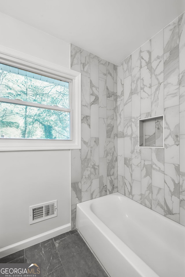 bathroom featuring a washtub