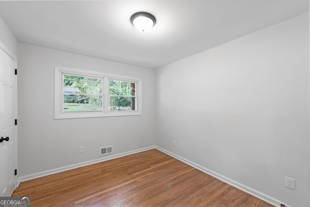 empty room featuring hardwood / wood-style floors