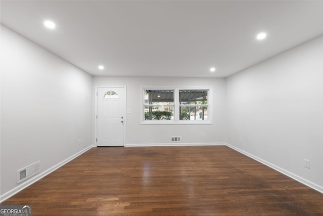 foyer with dark hardwood / wood-style flooring