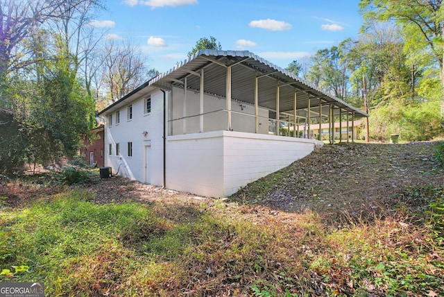 view of side of property with a sunroom