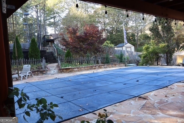 view of pool featuring a patio area