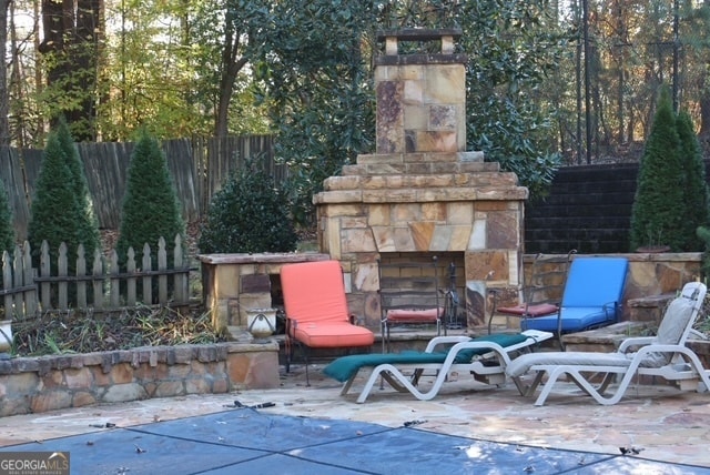 view of patio / terrace with an outdoor stone fireplace