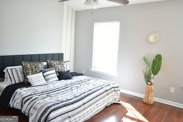 bedroom featuring dark hardwood / wood-style floors and ceiling fan