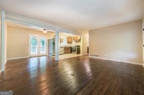 unfurnished living room featuring dark wood-type flooring