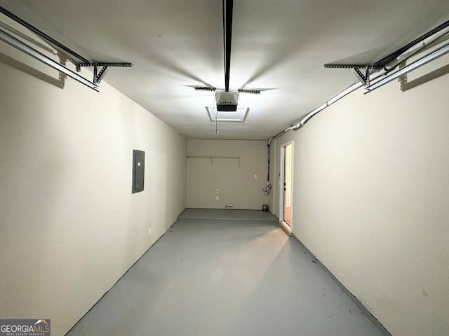 garage featuring a garage door opener and electric panel