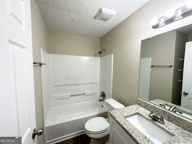 full bathroom with hardwood / wood-style floors, vanity, toilet, a textured ceiling, and shower / bath combination