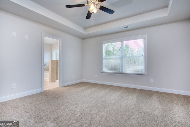 1091 Boulder Dr, Gray, GA 31032 - unfurnished room with light colored carpet, baseboards, and a tray ceiling
