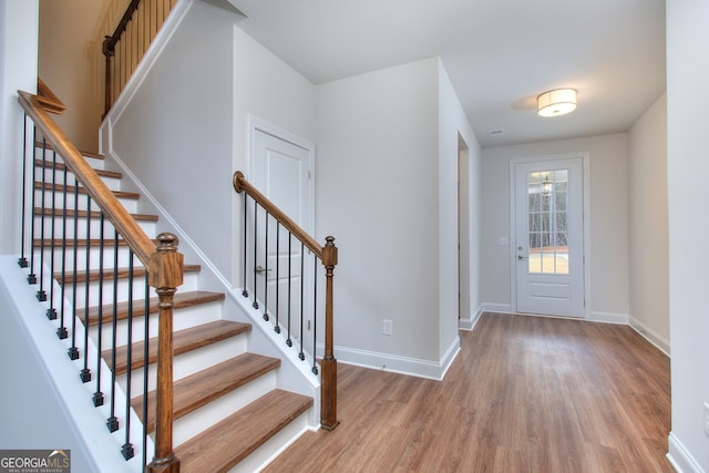 1091 Boulder Dr, Gray, GA 31032 - entrance foyer with wood finished floors, baseboards, and stairway