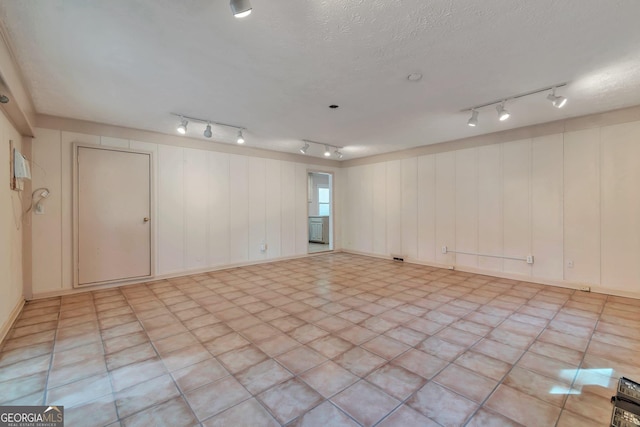 spare room featuring a textured ceiling