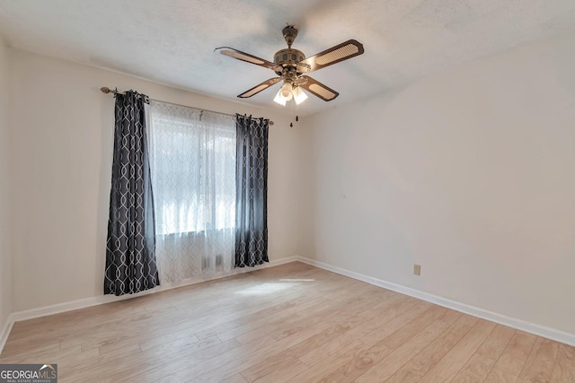 unfurnished room featuring ceiling fan, a textured ceiling, and light hardwood / wood-style floors