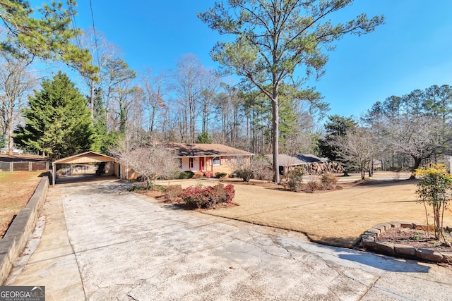 view of front of home featuring a carport