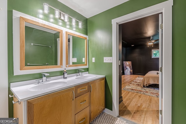 bathroom with vanity, hardwood / wood-style flooring, and ceiling fan