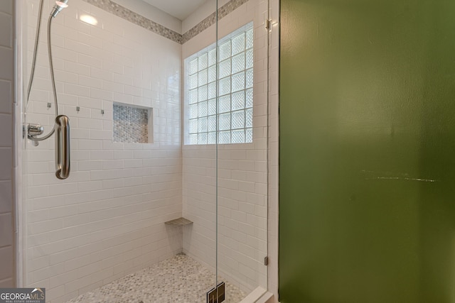 bathroom featuring an enclosed shower