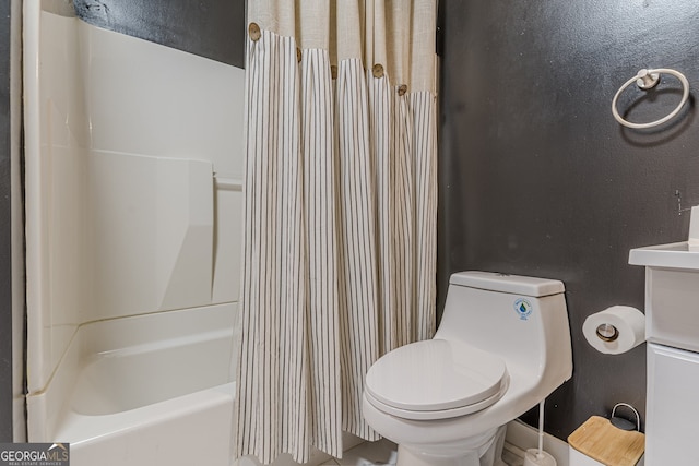 bathroom with shower / bath combination with curtain and toilet