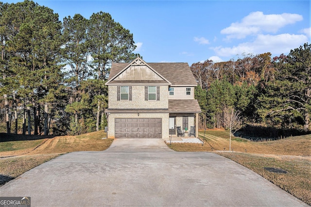 view of front property with a front lawn and a garage