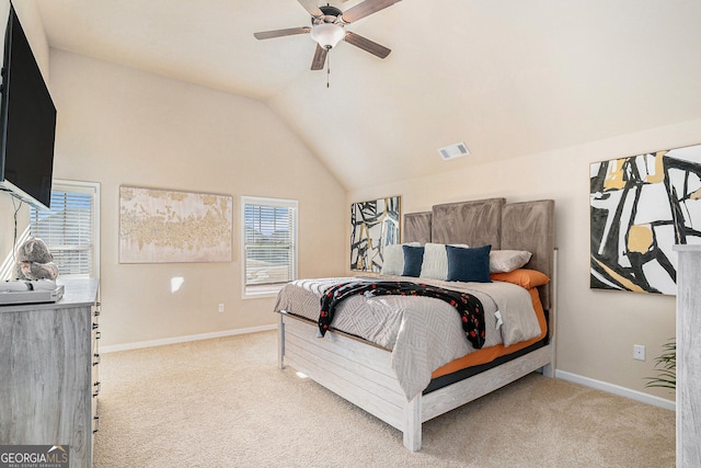 bedroom featuring multiple windows, ceiling fan, and light colored carpet