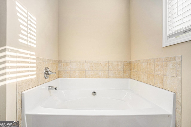 bathroom featuring a washtub