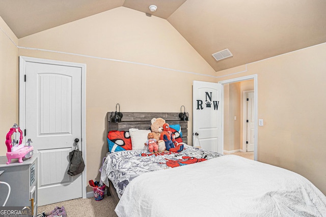 carpeted bedroom featuring vaulted ceiling